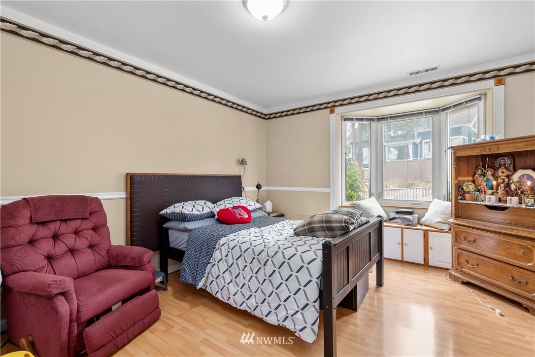 5069 Renton Avenue South Seattle, WA 98118 - Photo 18 of 40 a bedroom with furniture and a window