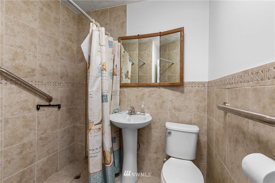 5069 Renton Avenue South Seattle, WA 98118 - Photo 20 of 40 a bathroom with a toilet sink and shower