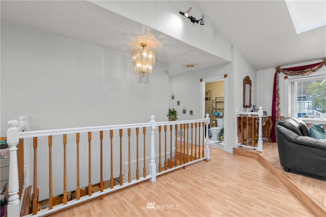 5069 Renton Avenue South Seattle, WA 98118 - Photo 3 of 40 a view of a livingroom with furniture wooden floor and staircase