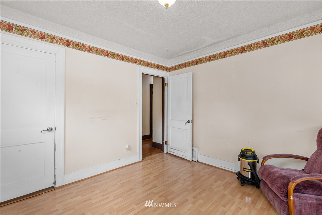 5069 Renton Avenue South Seattle, WA 98118 - Photo 24 of 40 a view of room with furniture and wooden floor