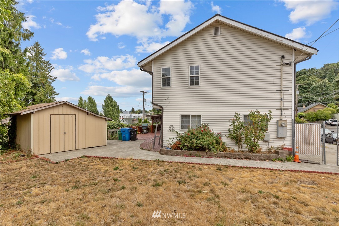 5069 Renton Avenue South Seattle, WA 98118 - Photo 38 of 40 a view of a house with backyard and bushes