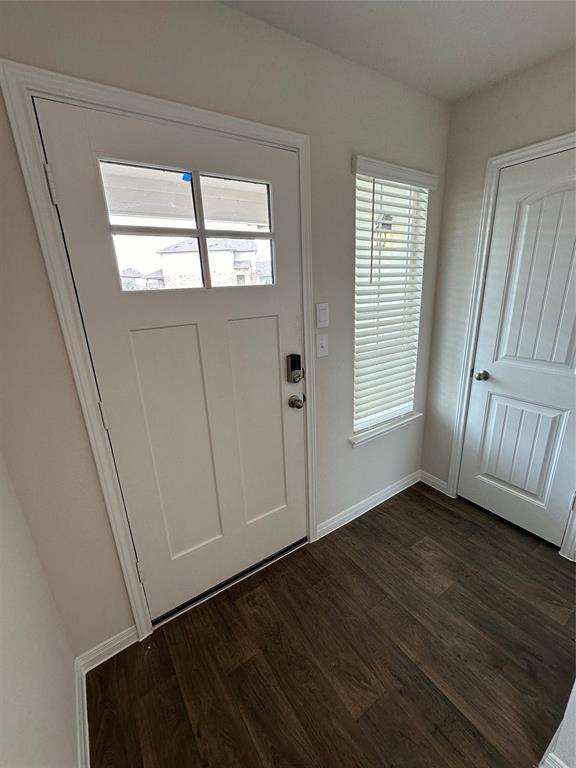 563 Evergreen Sumac Loop Kyle, TX 78640 - Photo 3 of 18 Rich hardwood-style flooring extends from the entryway, creating a refined first impression.