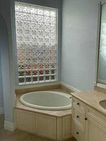 a bathroom with a bathtub and a sink