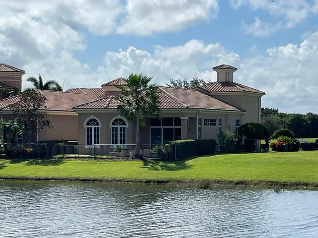 a view of a lake with houses in the background