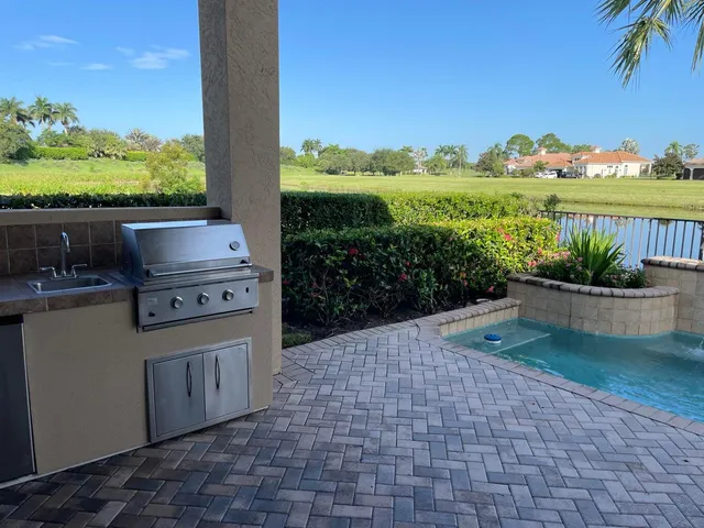 a view of a lake with houses in the background