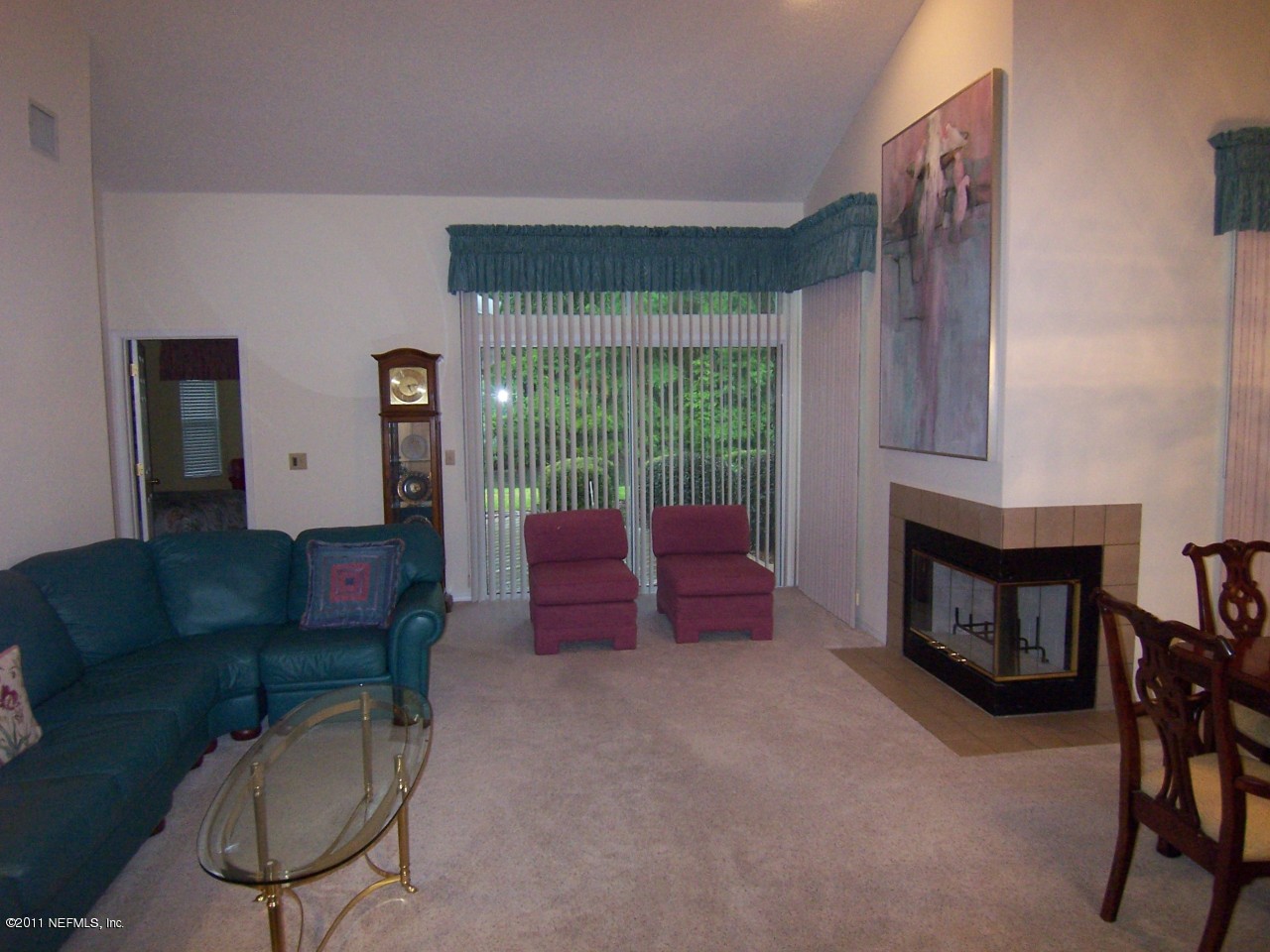 1488 Marsh Rabbit Way Fleming Island, FL 32003 - Photo 3 of 17 a living room with furniture and a fireplace