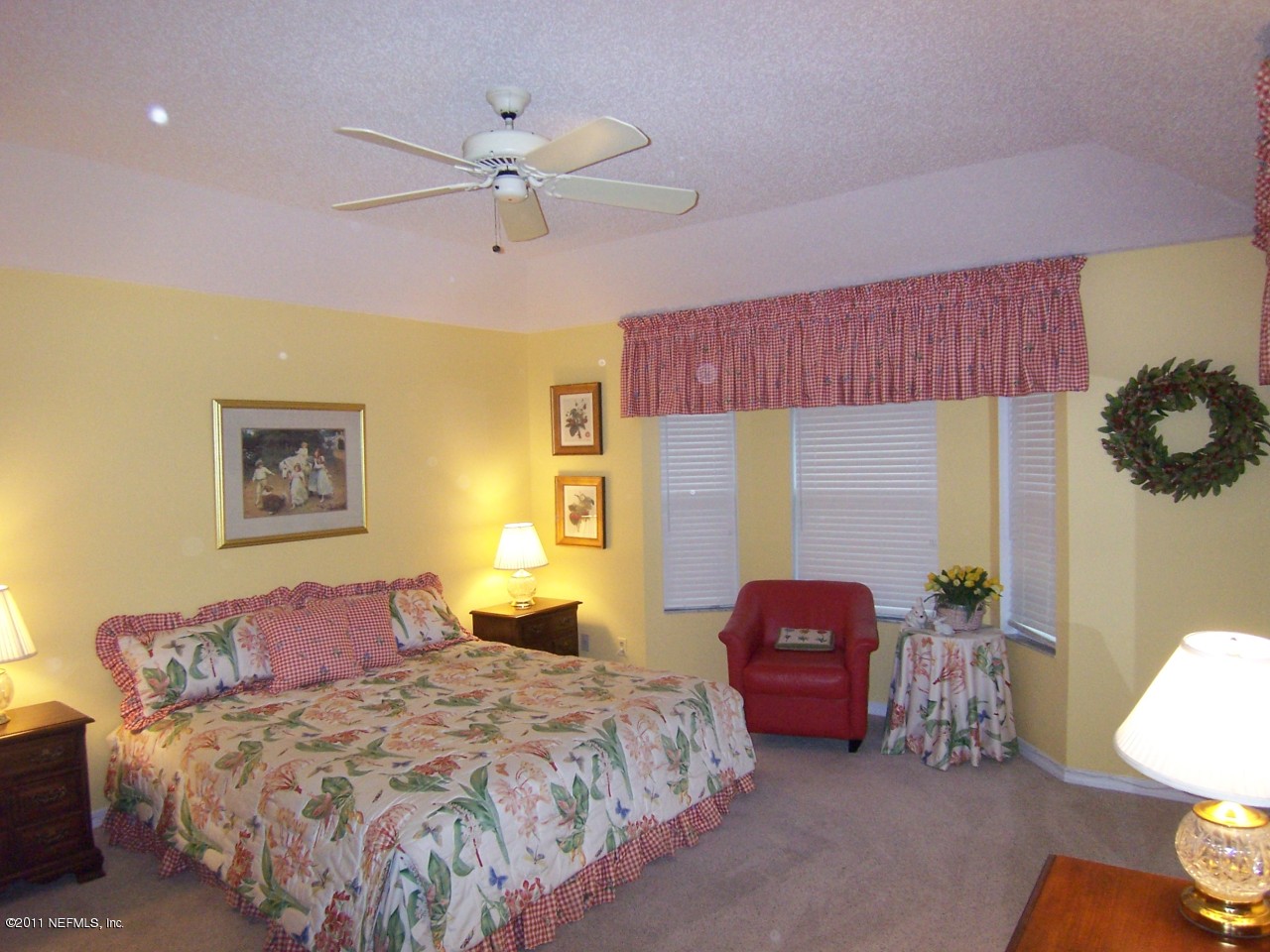 1488 Marsh Rabbit Way Fleming Island, FL 32003 - Photo 7 of 17 a bedroom with a bed and window