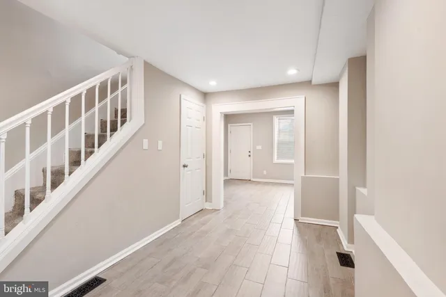 a view of an entryway with wooden floor
