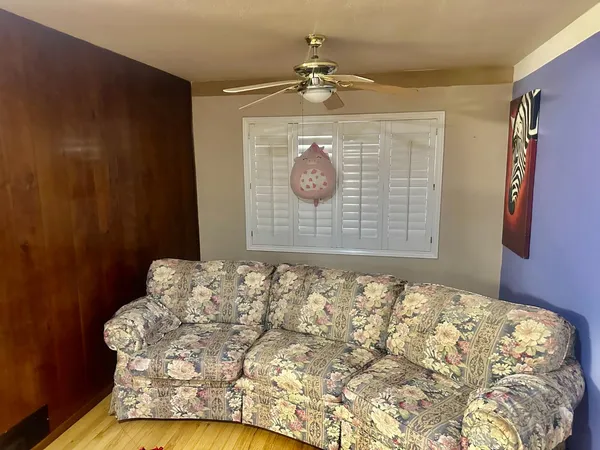 a living room with a couch and a fireplace