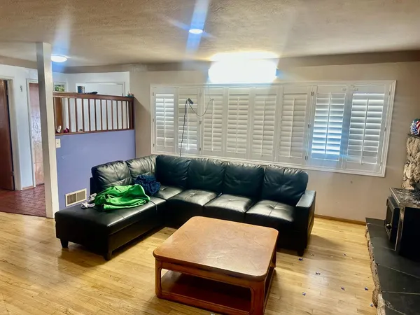 a bedroom with a bed and a chair