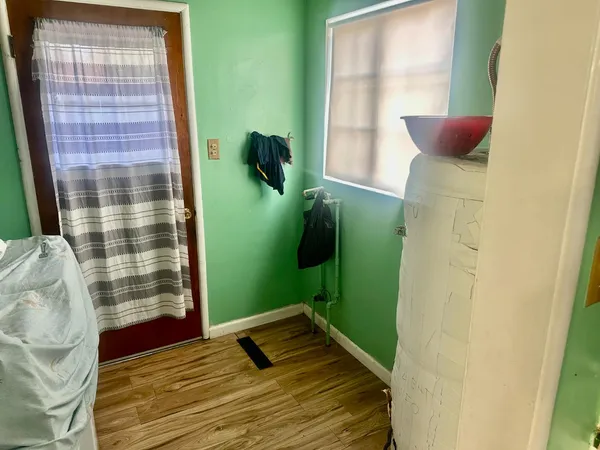 a living room with a couch and a table with wooden floor