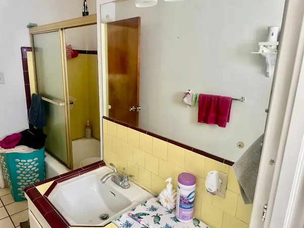 a backyard of a house with table and chairs