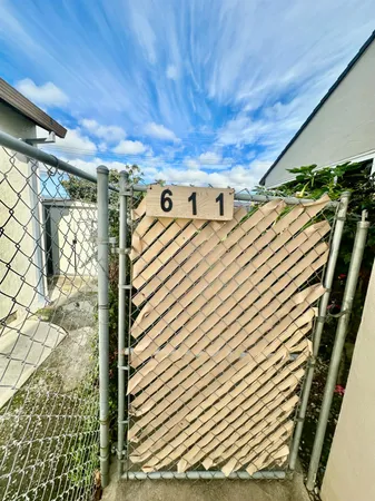 a living room with furniture and a mirror