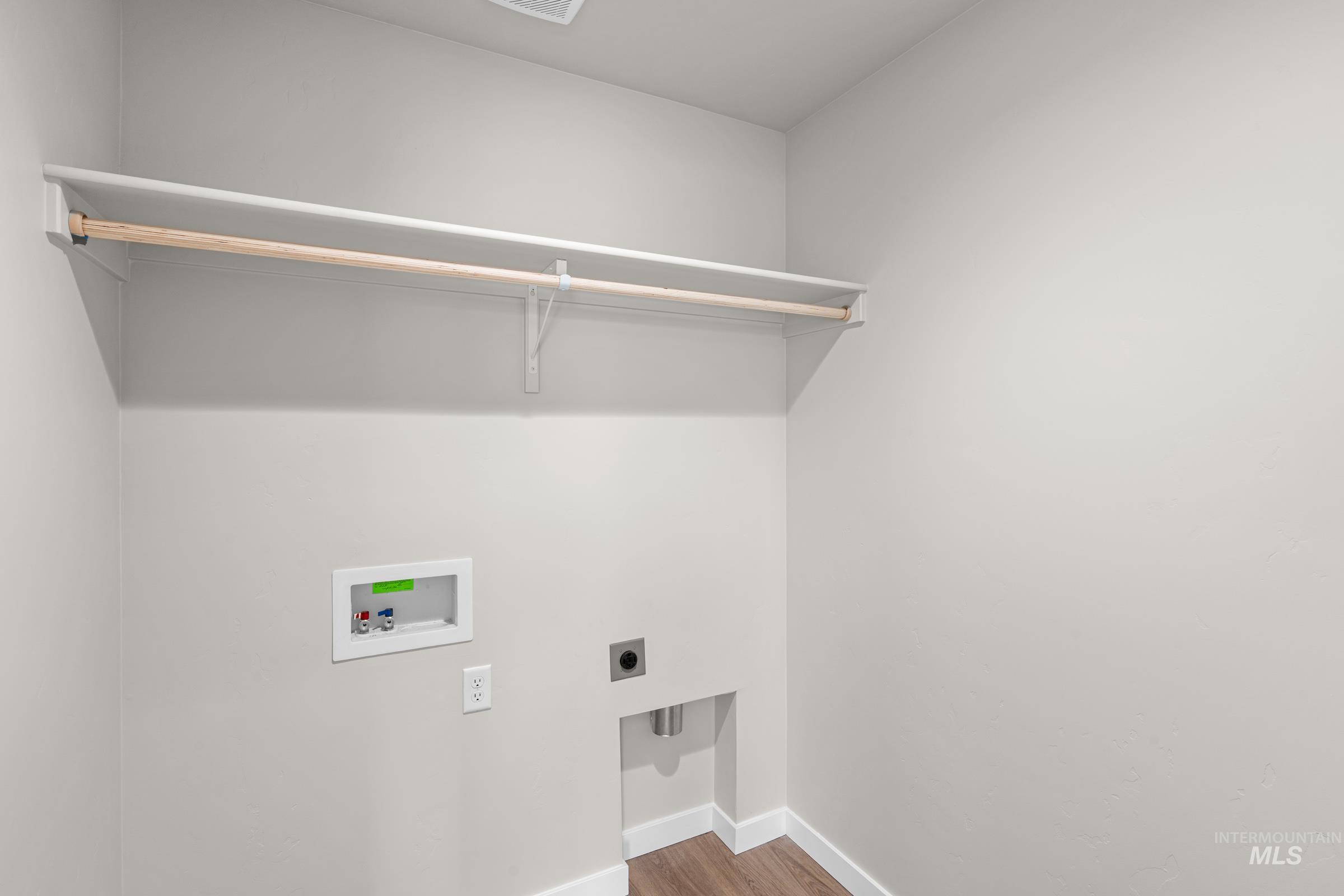 503 Hamlow Avenue Middleton, ID 83644 - Photo 13 of 21 Laundry room with hookup for an electric dryer, wood finished floors, and washer hookup
