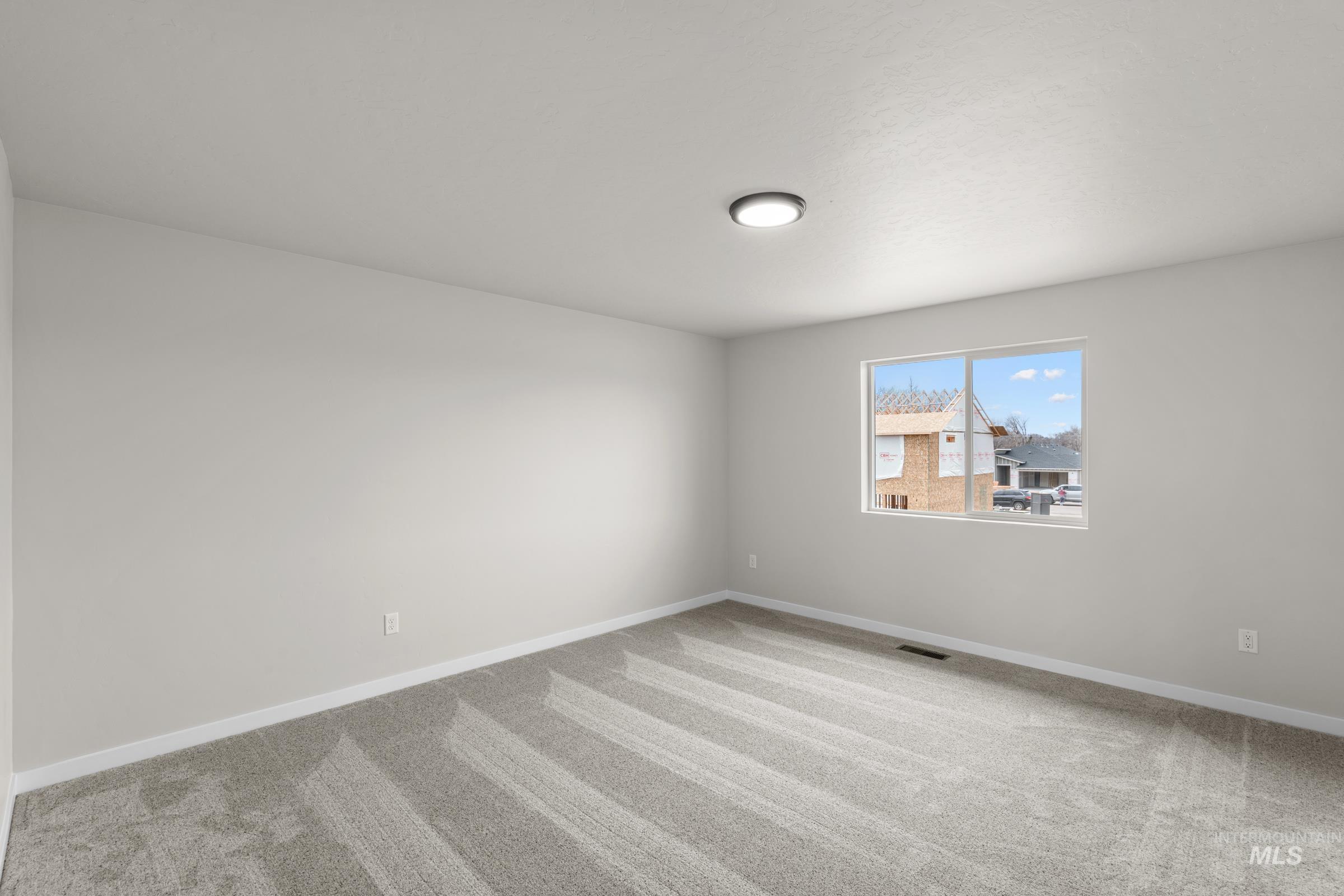 503 Hamlow Avenue Middleton, ID 83644 - Photo 16 of 21 Empty room with light carpet and baseboards