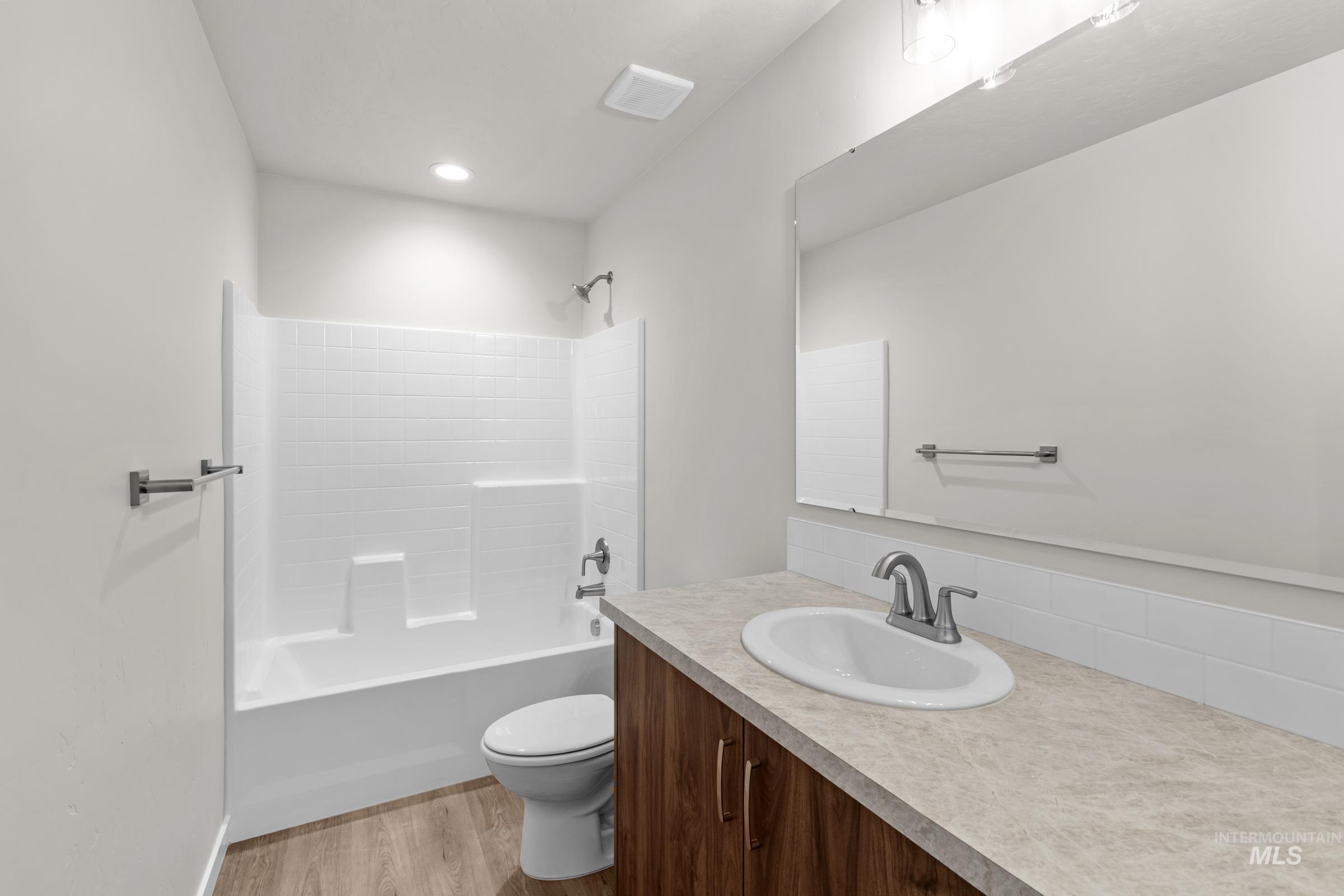 503 Hamlow Avenue Middleton, ID 83644 - Photo 20 of 21 Full bathroom with vanity, tub / shower combination, and light wood finished floors