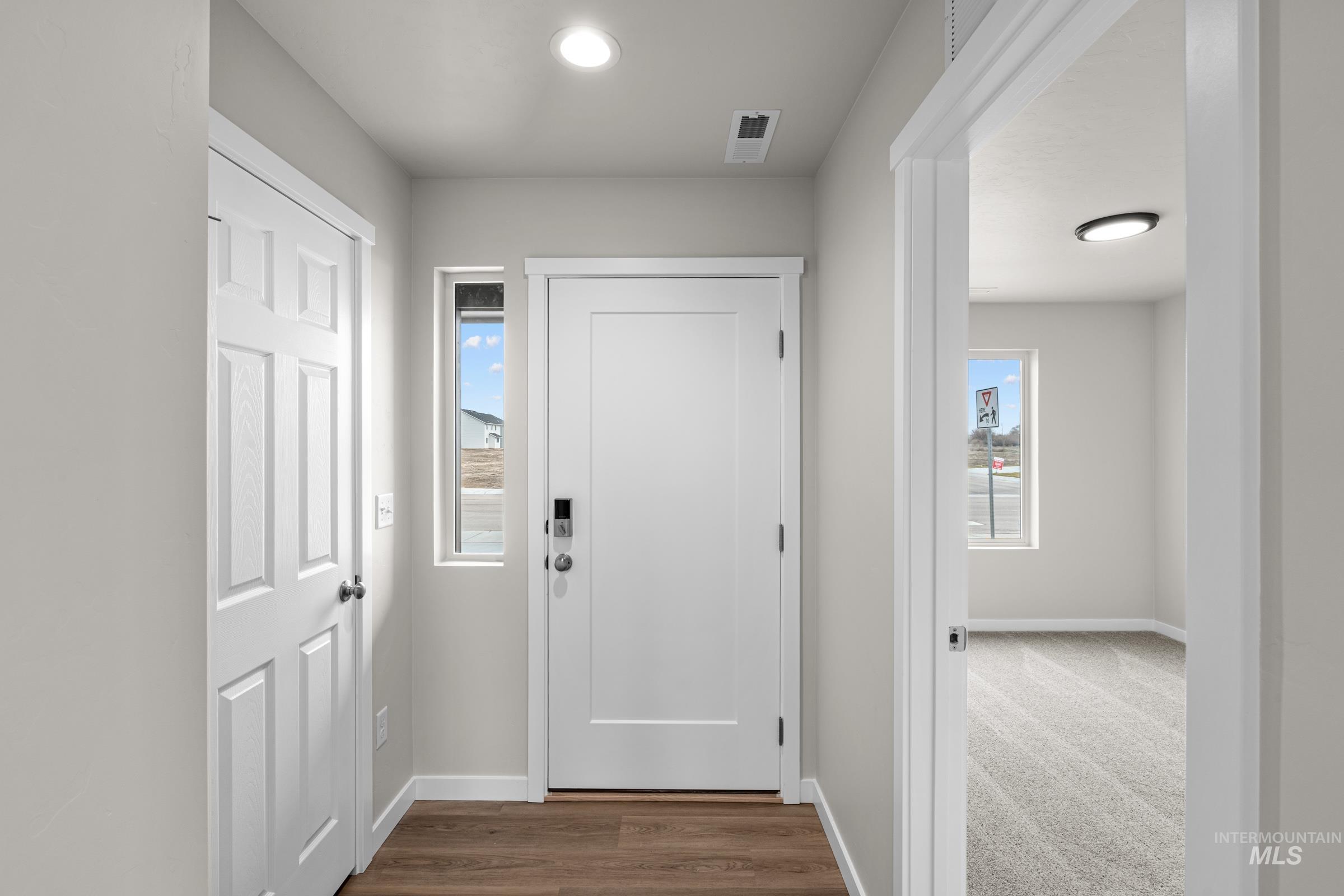503 Hamlow Avenue Middleton, ID 83644 - Photo 2 of 21 Doorway to outside with baseboards and wood finished floors