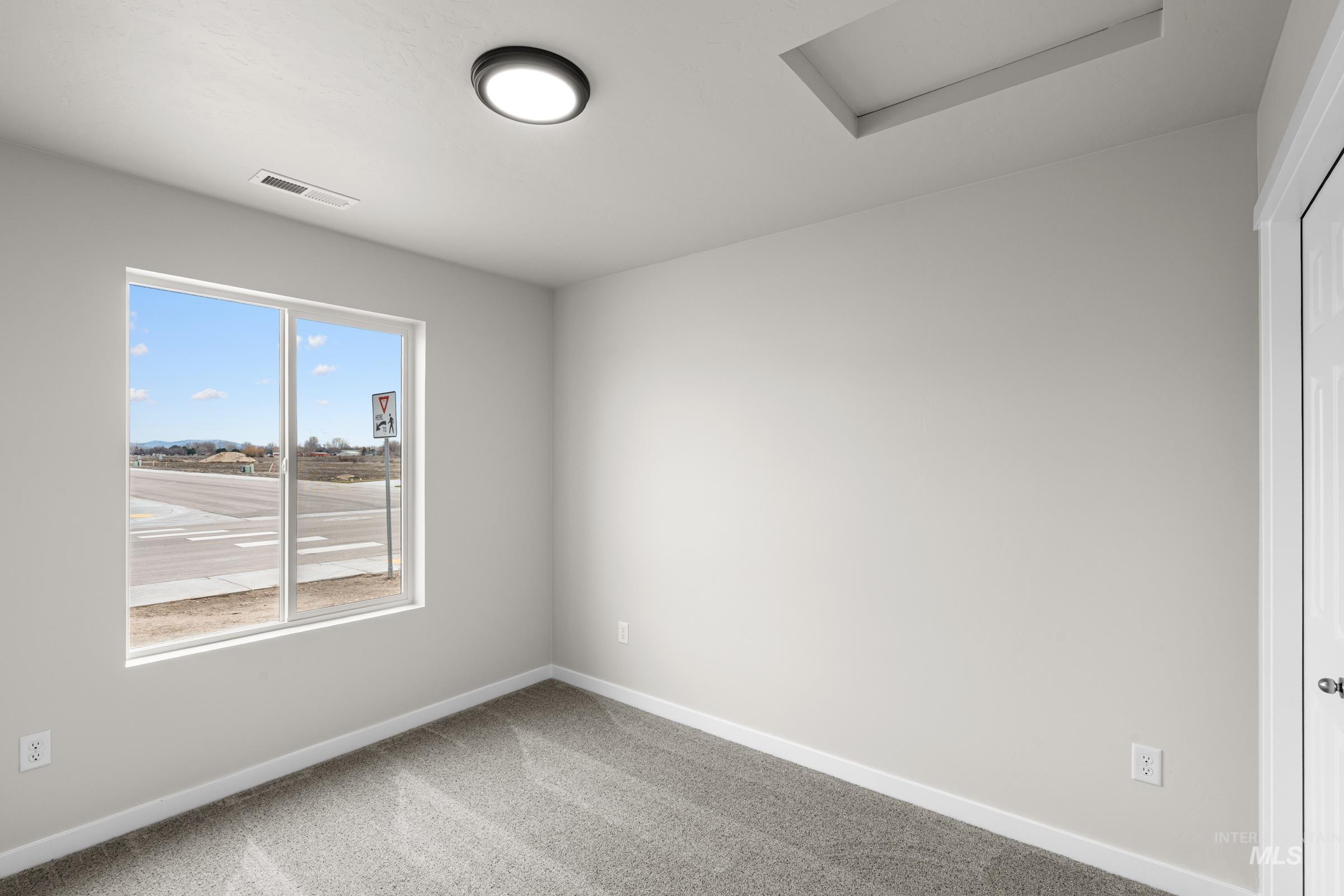503 Hamlow Avenue Middleton, ID 83644 - Photo 10 of 21 Spare room with light carpet and baseboards