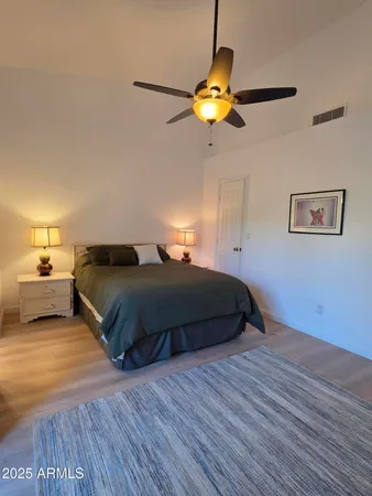 a bedroom with a bed and window