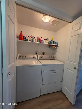 a bedroom with a bed and a television