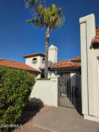 a view of a patio with table and chairs and potted plants