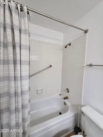 a view of a porch with furniture and a yard