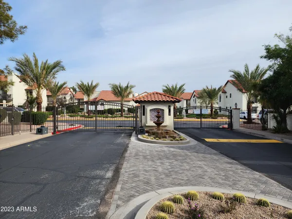 a front view of multiple houses with yard