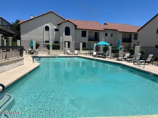 a view of a house with swimming pool
