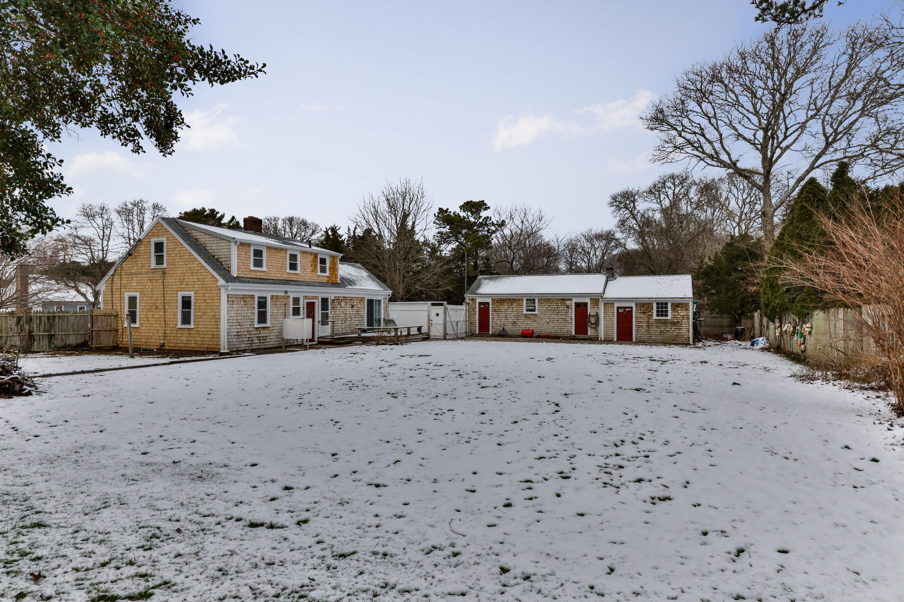 180 Lincoln Road Hyannis, MA 02601 - Photo 23 of 26 a front view of a house with a yard and large trees