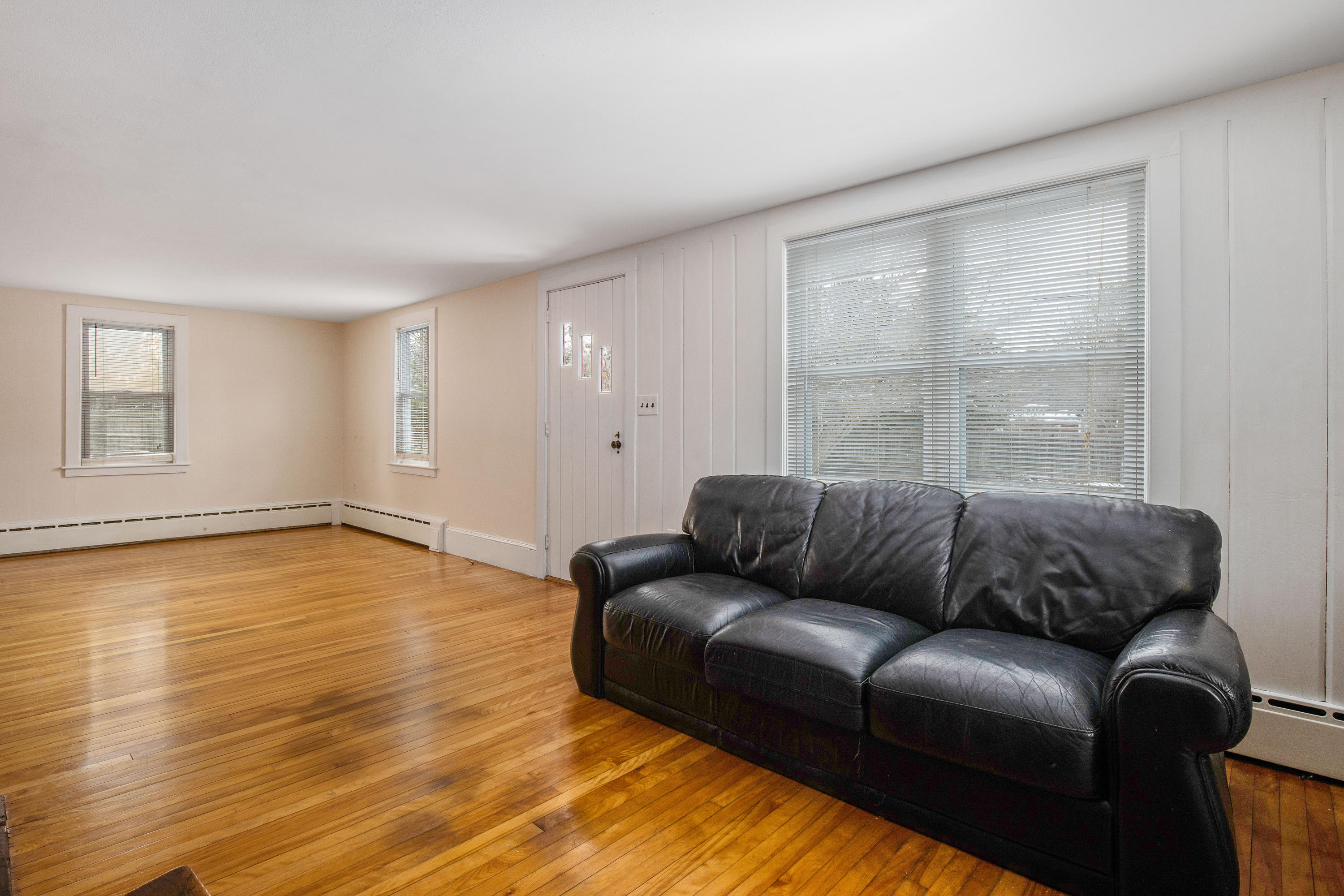 180 Lincoln Road Hyannis, MA 02601 - Photo 9 of 26 a living room with furniture and a large window