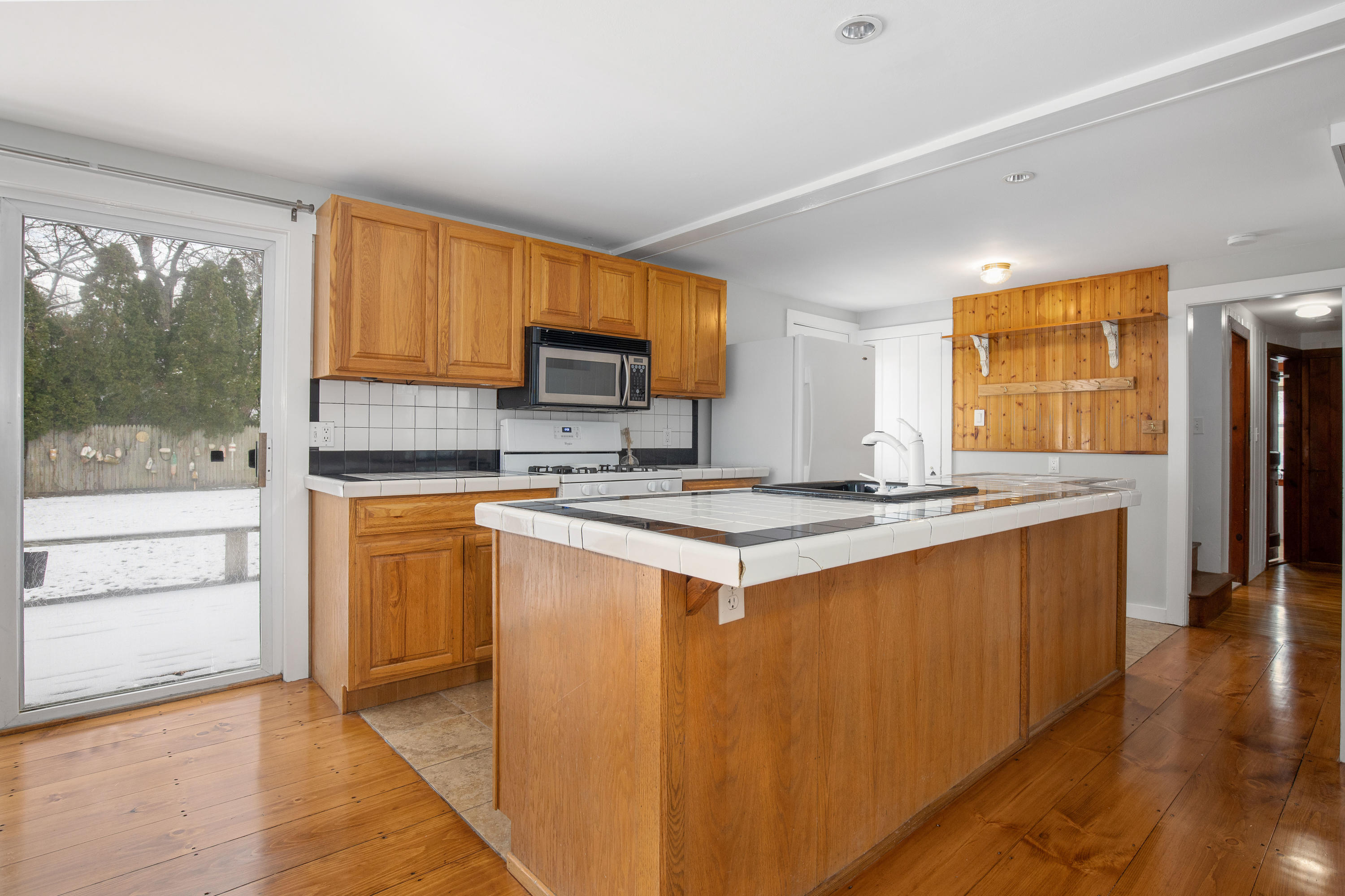 180 Lincoln Road Hyannis, MA 02601 - Photo 10 of 26 a kitchen with stainless steel appliances granite countertop a refrigerator a stove and a sink with cabinets