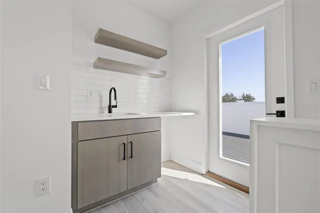 a bathroom with a sink a mirror and vanity