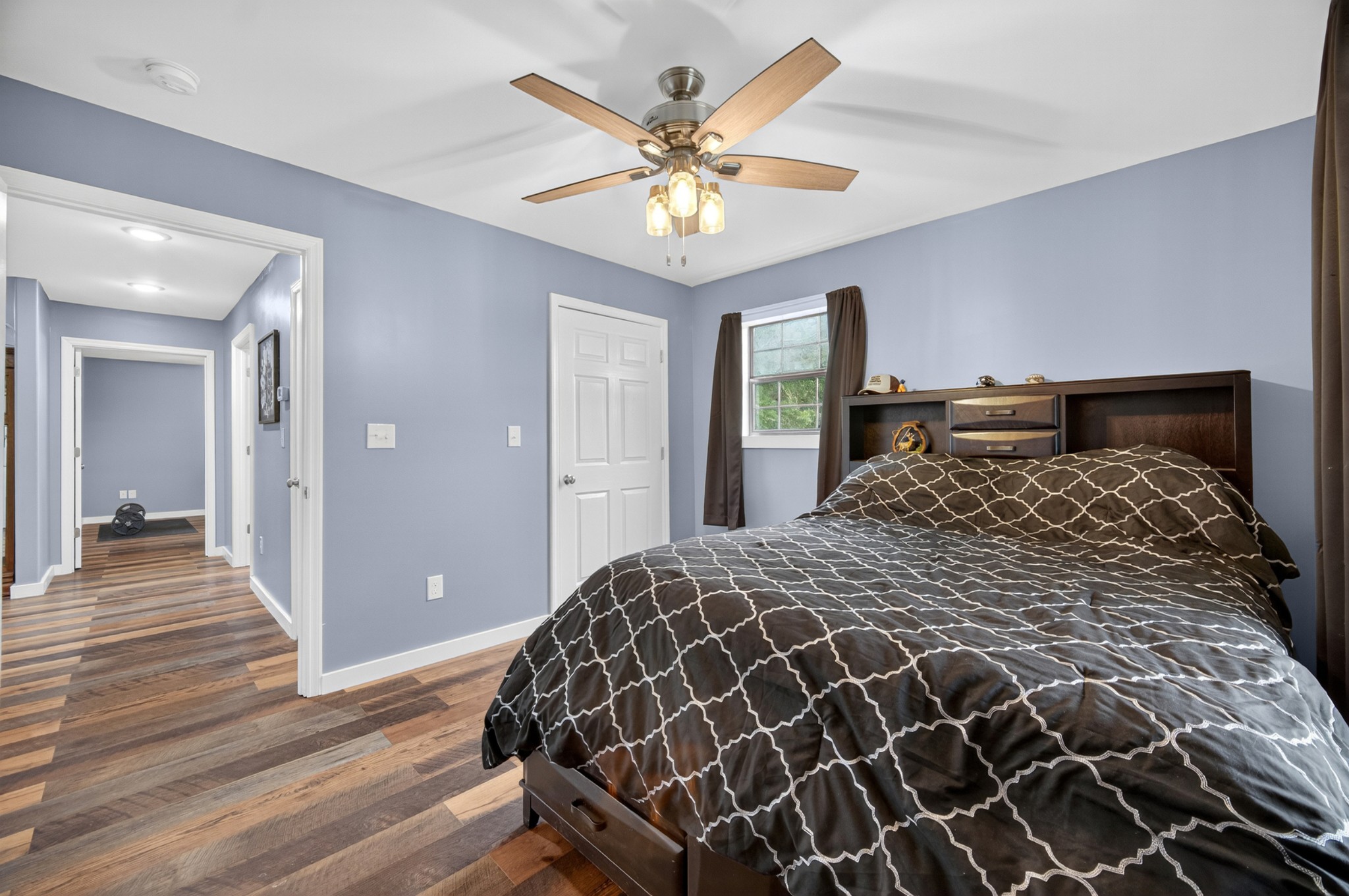 63 North King Road Flintville, TN 37335 - Photo 29 of 37 a bed sitting in a bedroom and a chandelier