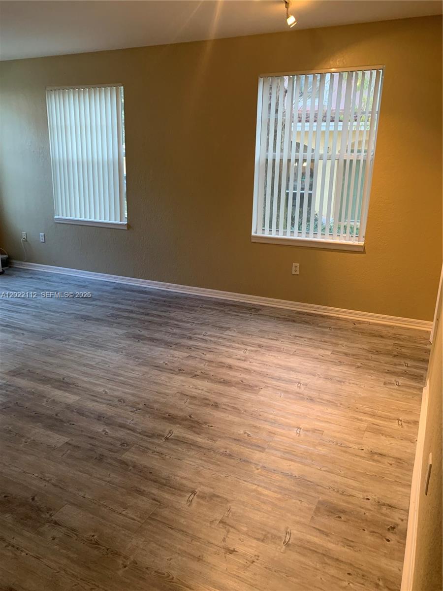 6572 West Sample Road, Unit 6572 Coral Springs, FL 33067 - Photo 12 of 17 a view of an empty room with a window