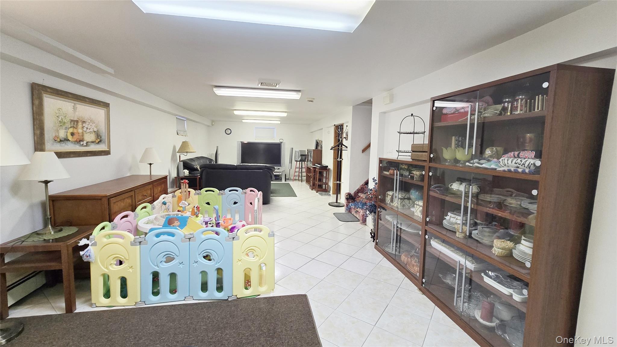 154-07 24th Road Queens, NY 11357 - Photo 13 of 16 a bedroom with furniture and a wooden floor
