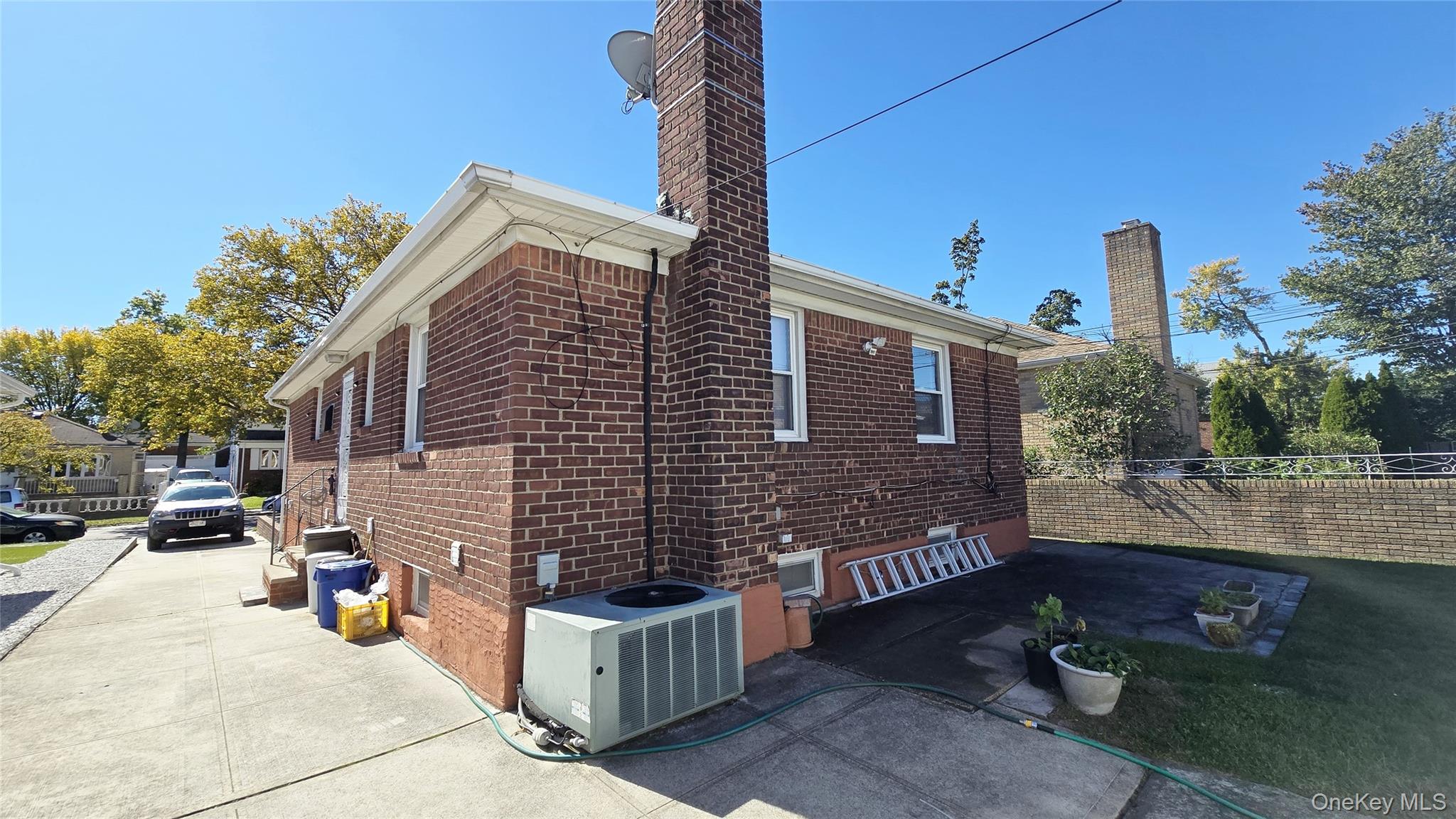 154-07 24th Road Queens, NY 11357 - Photo 16 of 16 a view of a brick house with a street