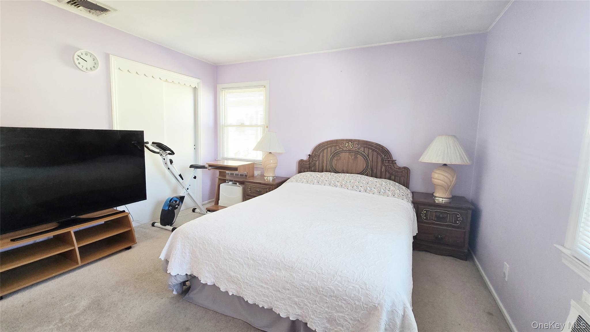 154-07 24th Road Queens, NY 11357 - Photo 10 of 16 a bedroom with a bed tv and table