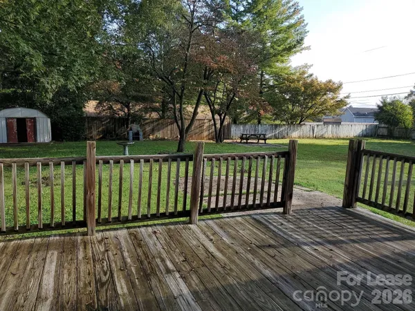 a view of a wooden roof deck