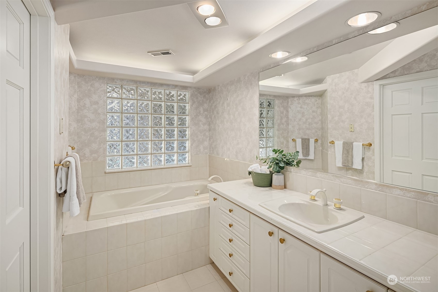 1220 Viewland Way Edmonds, WA 98020 - Photo 35 of 40 a bathroom with a granite countertop sink mirror bathtub and shower