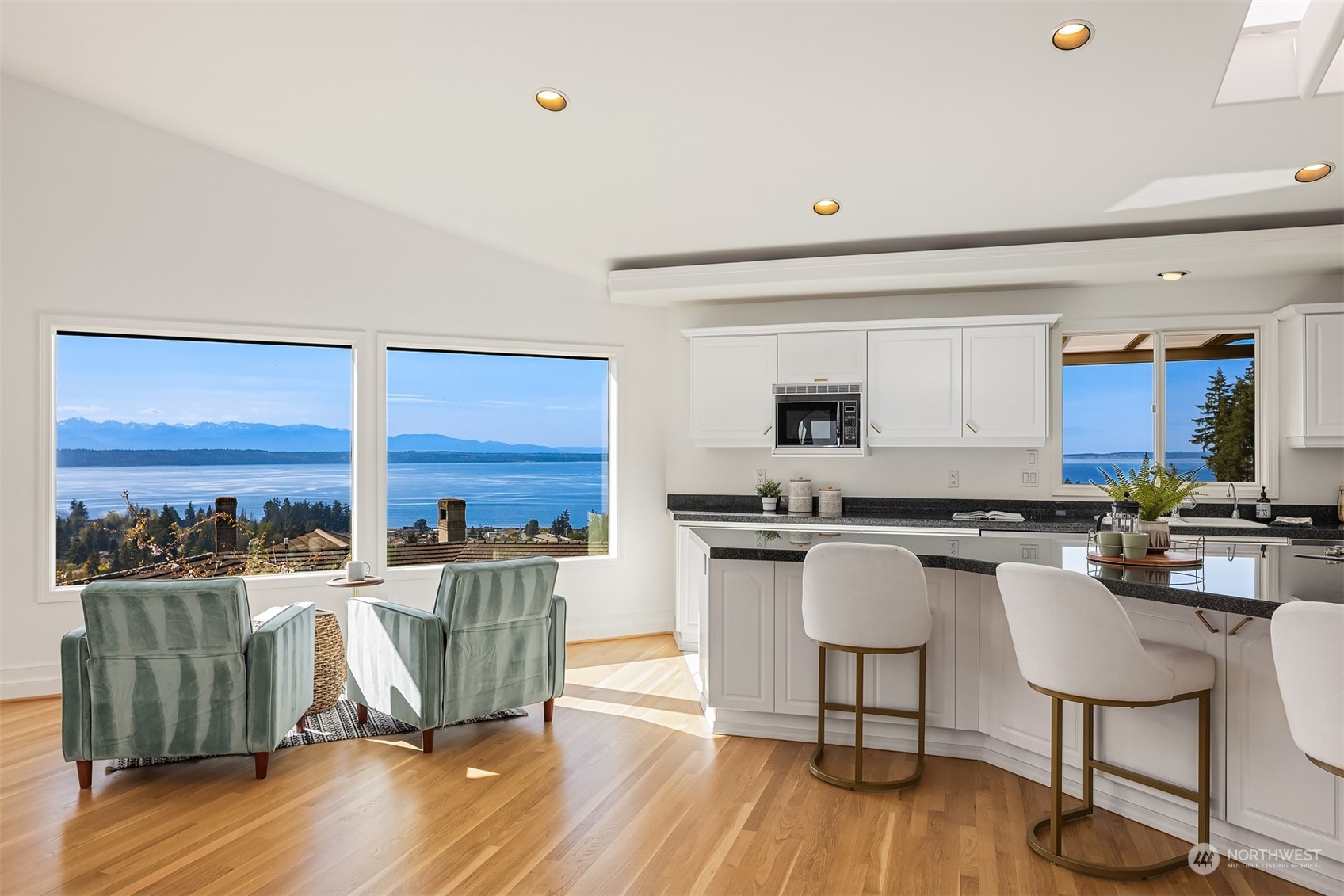 1220 Viewland Way Edmonds, WA 98020 - Photo 5 of 40 a kitchen with a table chairs stove and wooden floor