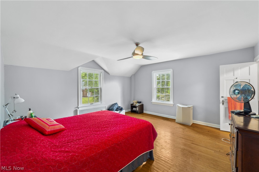 3045 Keswick Road Cleveland, OH 44120 - Photo 33 of 48 Bedroom with vaulted ceiling, wood-type flooring, and ceiling fan