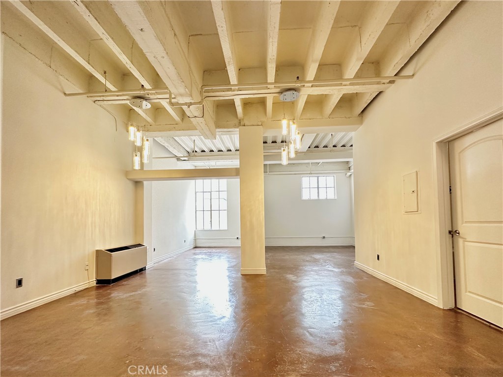312 West 5th Street, Unit 604 Los Angeles, CA 90013 - Photo 1 of 13 a view of a hallway with wooden floor
