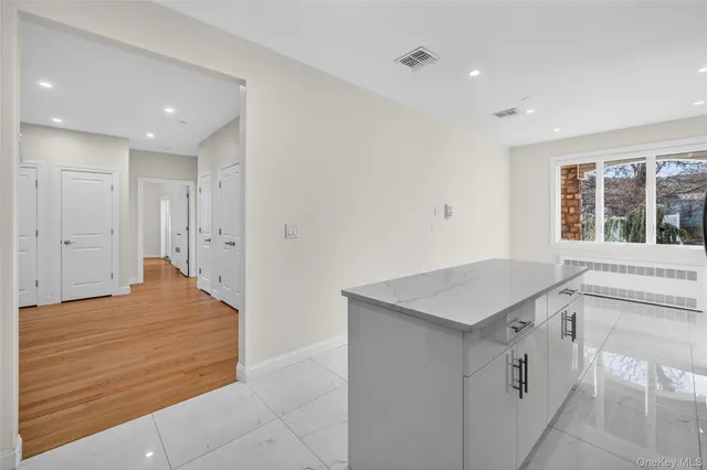 a kitchen with a sink a stove and cabinets