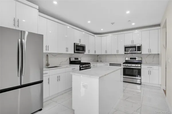a view of empty room with closet and wooden floor