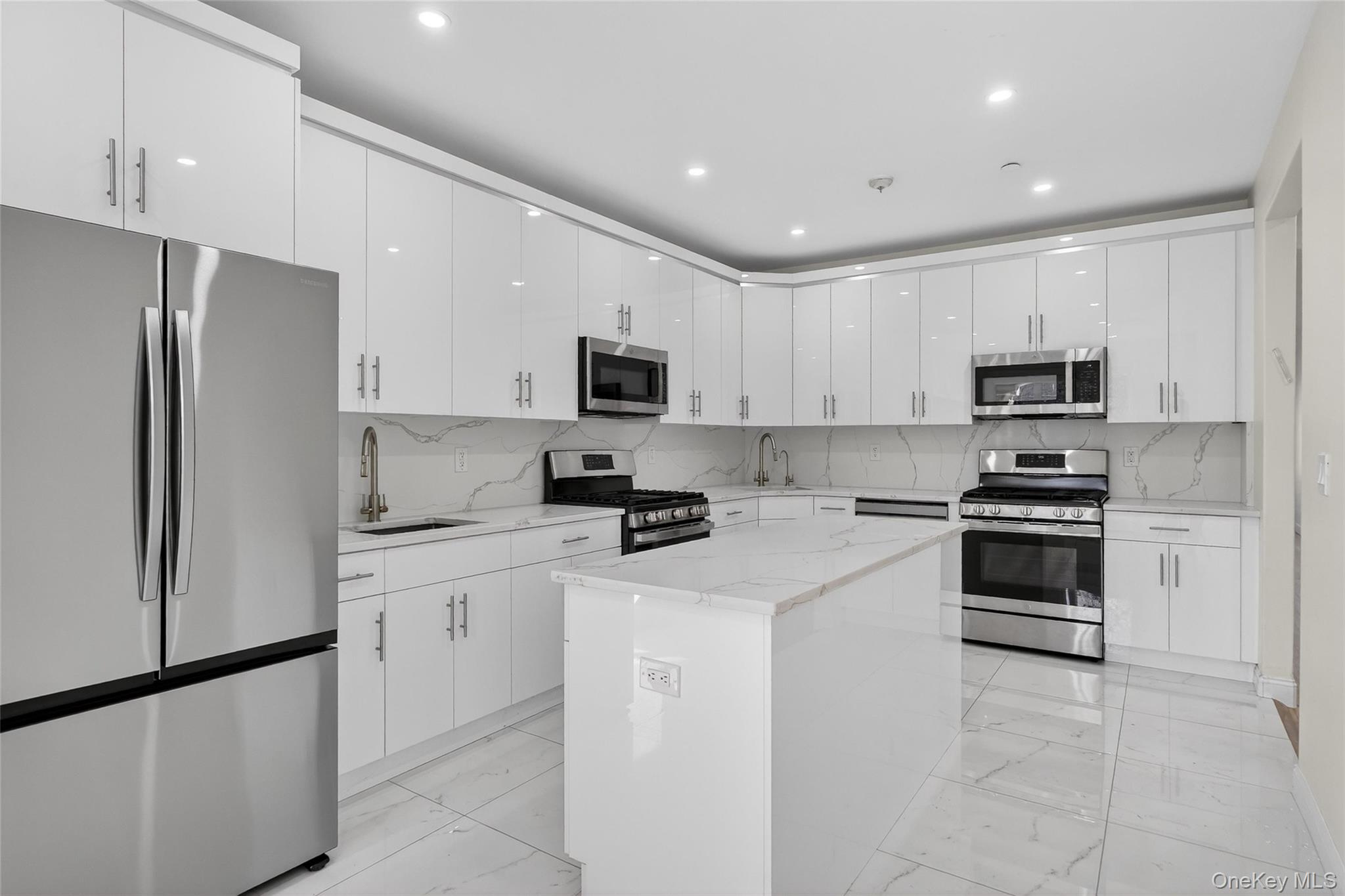 2 Bluefield Drive, Unit 103 Spring Valley, NY 10977 - Photo 15 of 42 a kitchen with cabinets stainless steel appliances and a counter space