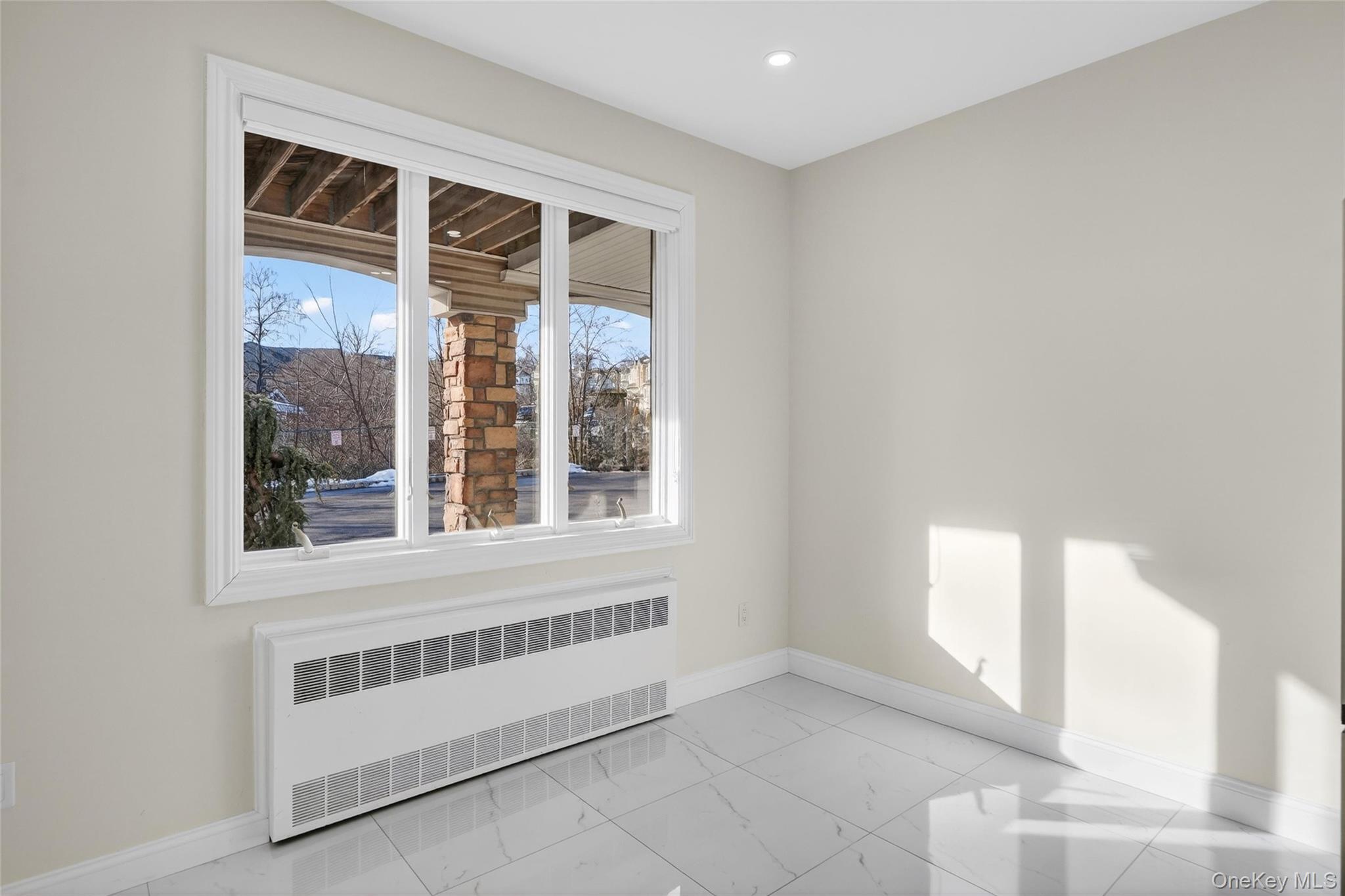 2 Bluefield Drive, Unit 103 Spring Valley, NY 10977 - Photo 16 of 42 a view of an empty room with a window