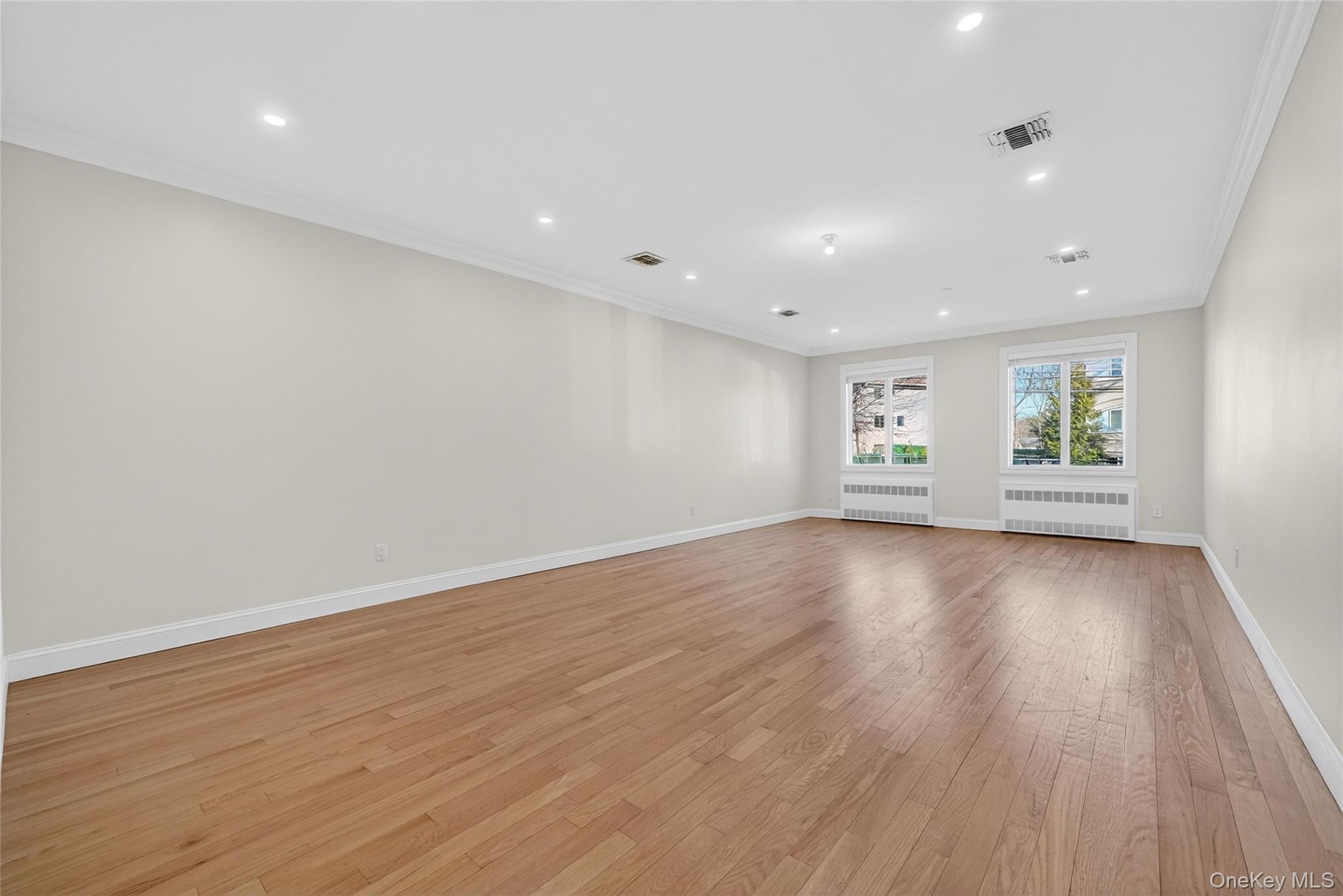 2 Bluefield Drive, Unit 103 Spring Valley, NY 10977 - Photo 19 of 42 a view of empty room with wooden floor and fan