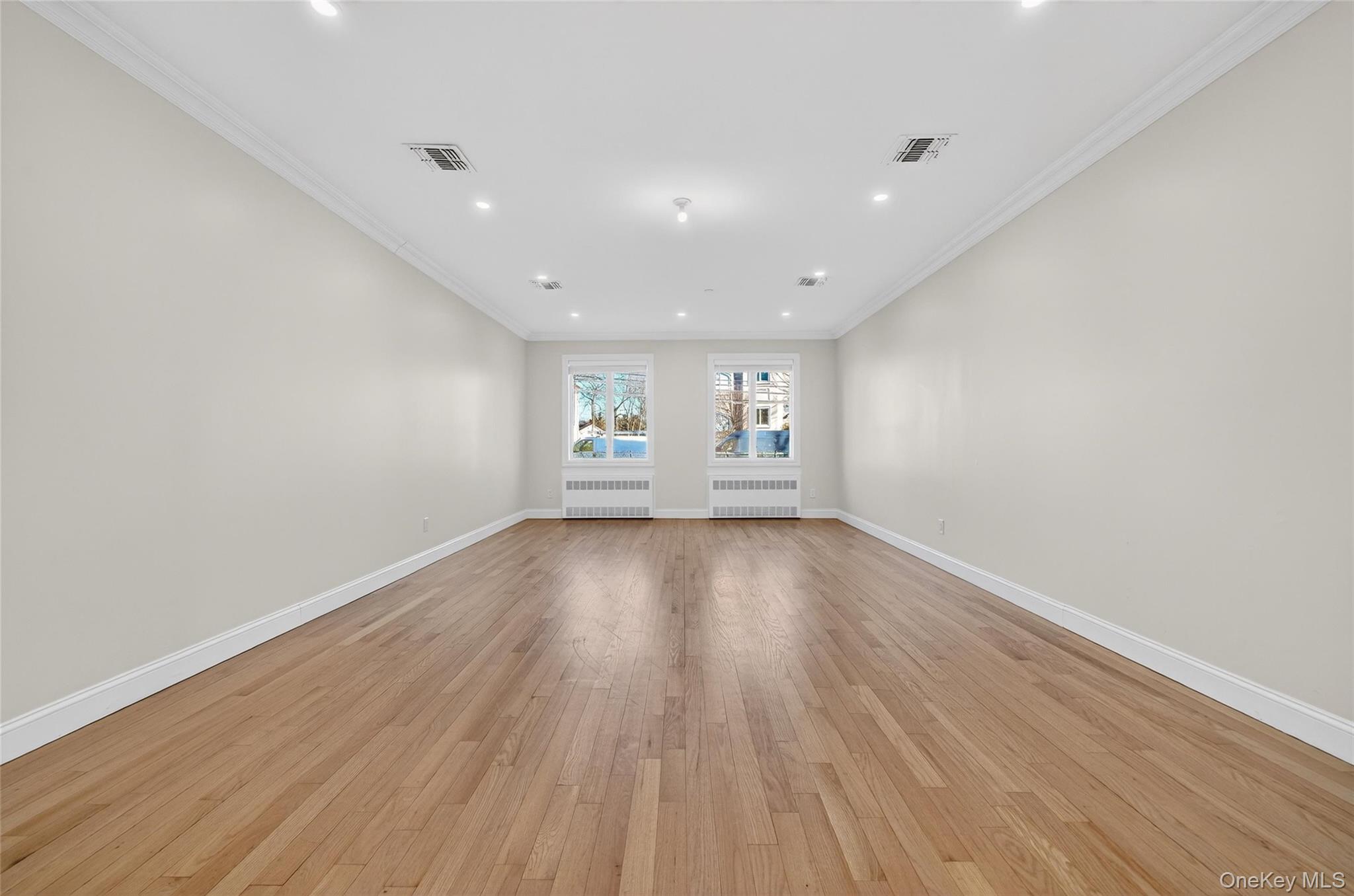 2 Bluefield Drive, Unit 103 Spring Valley, NY 10977 - Photo 20 of 42 a view of empty room with wooden floor and fan
