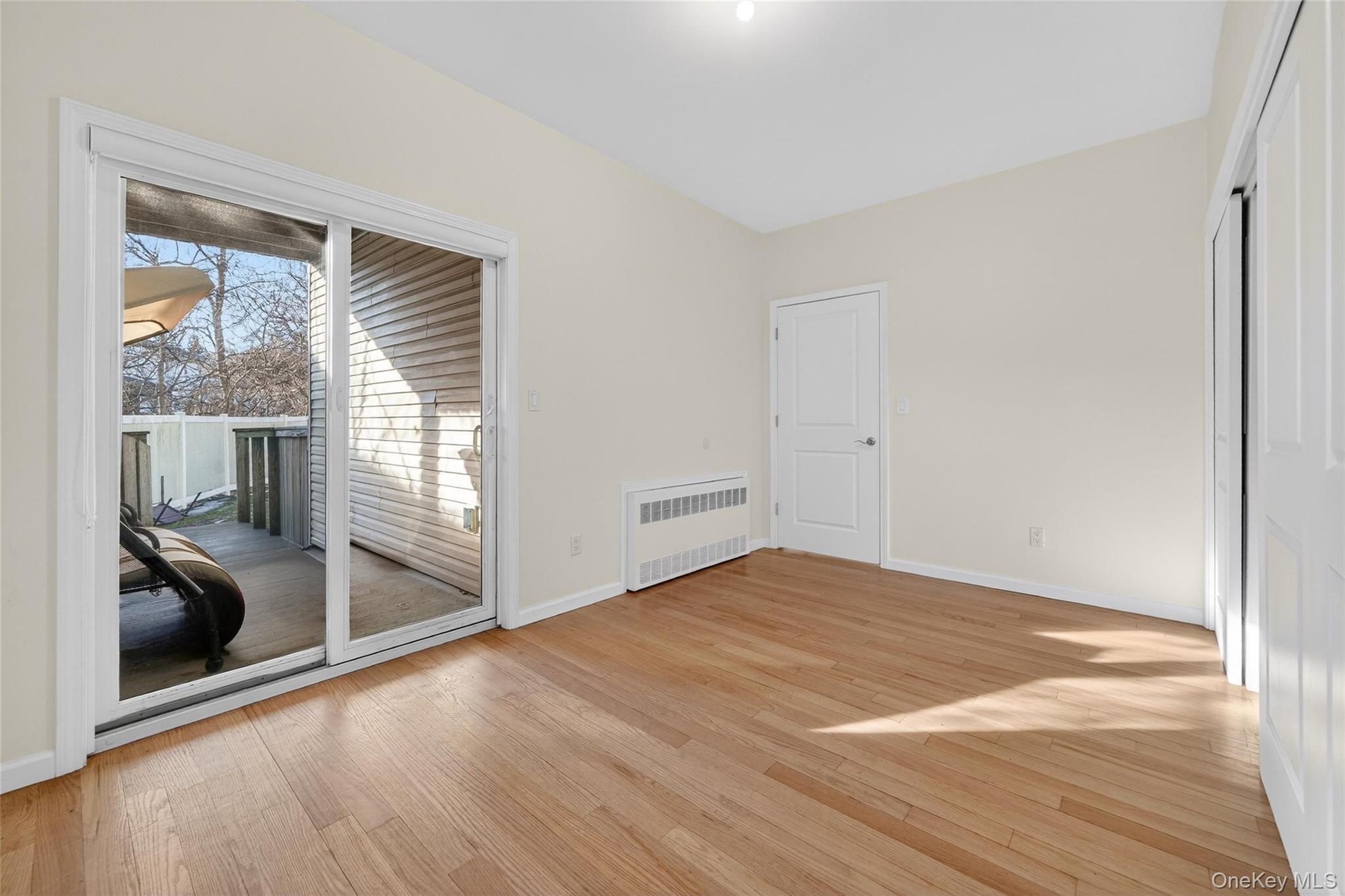 2 Bluefield Drive, Unit 103 Spring Valley, NY 10977 - Photo 24 of 42 a view of an empty room with glass door