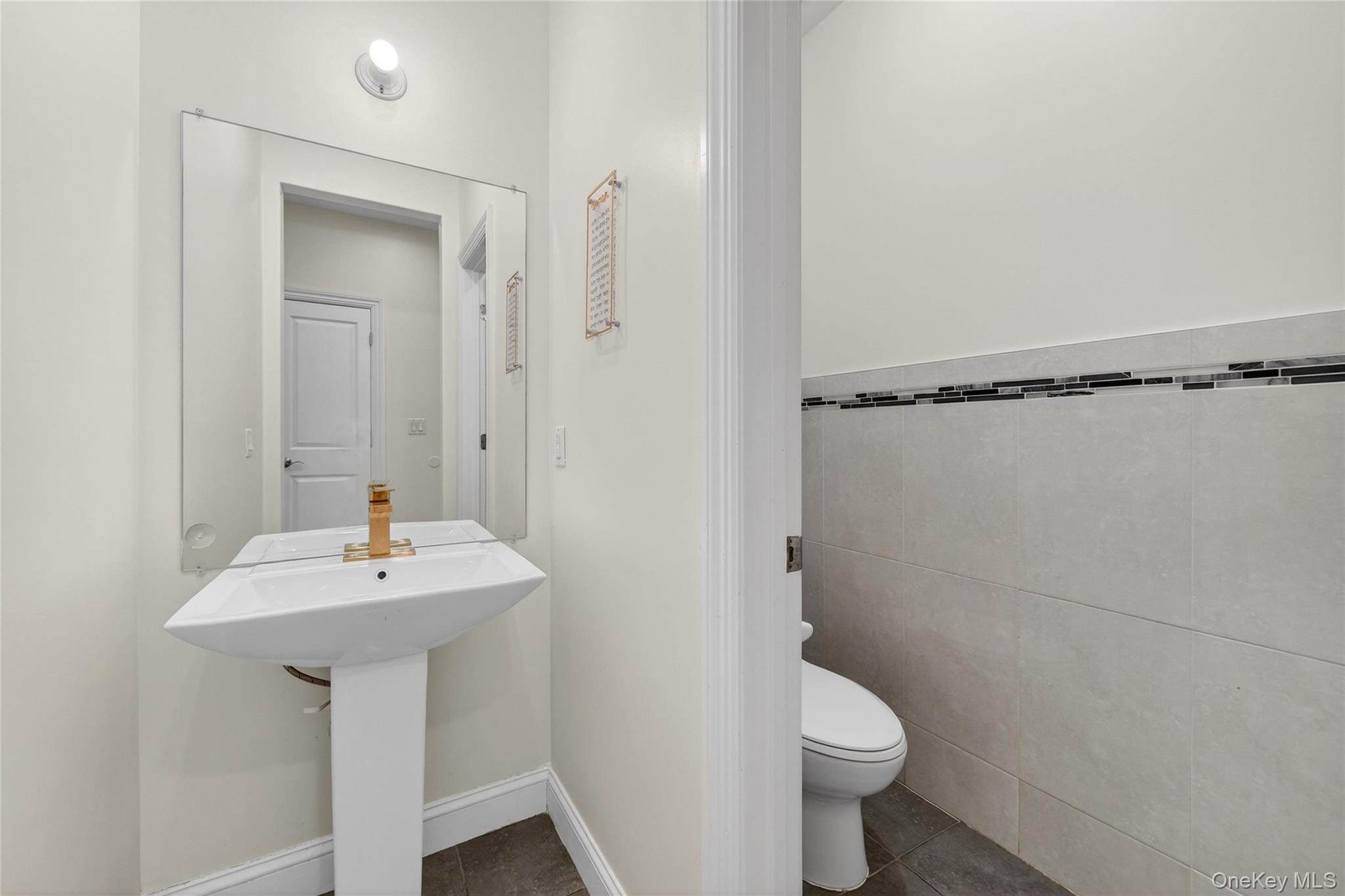 2 Bluefield Drive, Unit 103 Spring Valley, NY 10977 - Photo 26 of 42 a bathroom with a sink a toilet and shower
